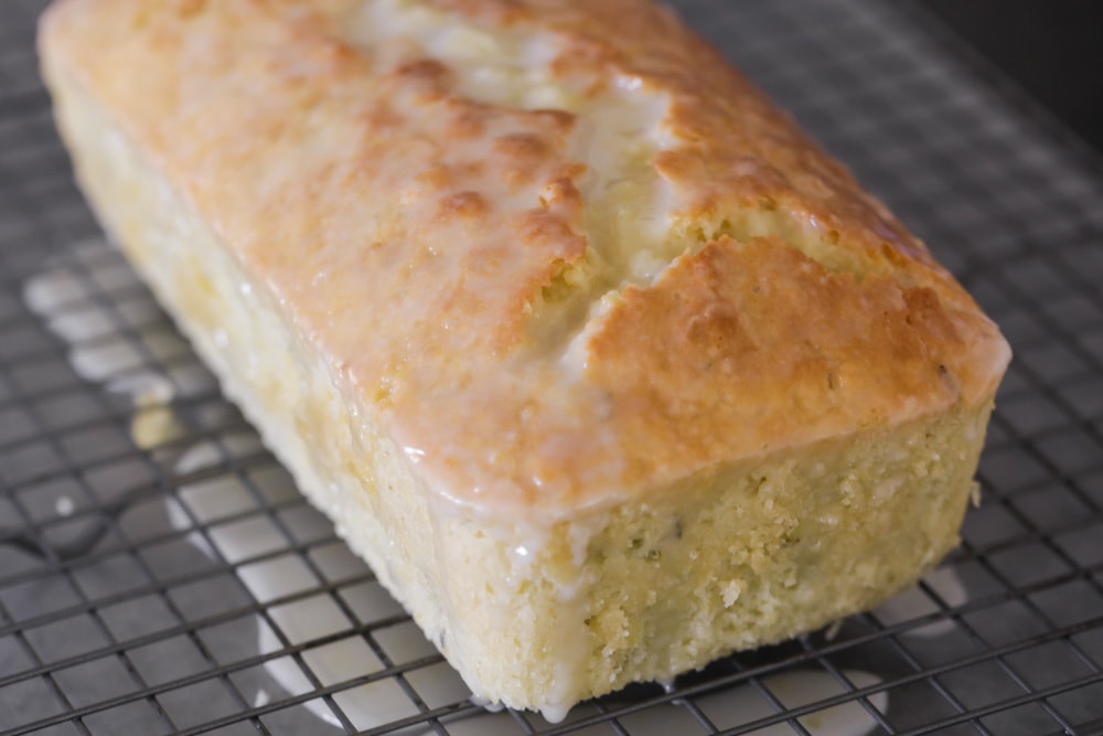 Zucchini bread with lemon glaze poured over the top.