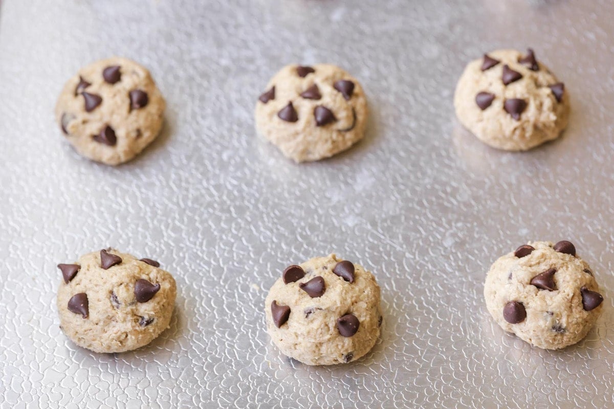 Oatmeal chocolate chip cookie dough on a baking sheet
