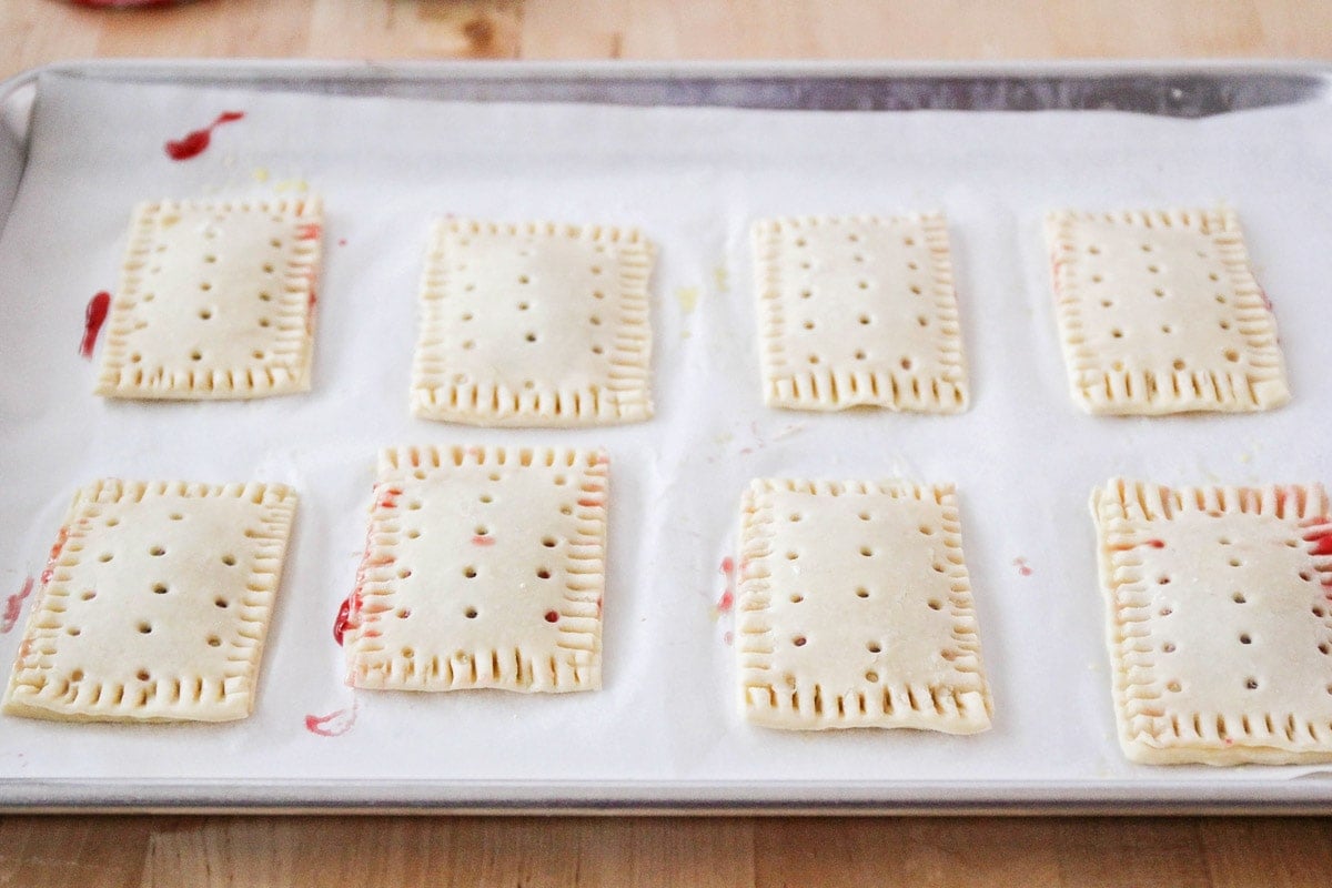 Homemade pop tarts on a baking sheet before going in the oven