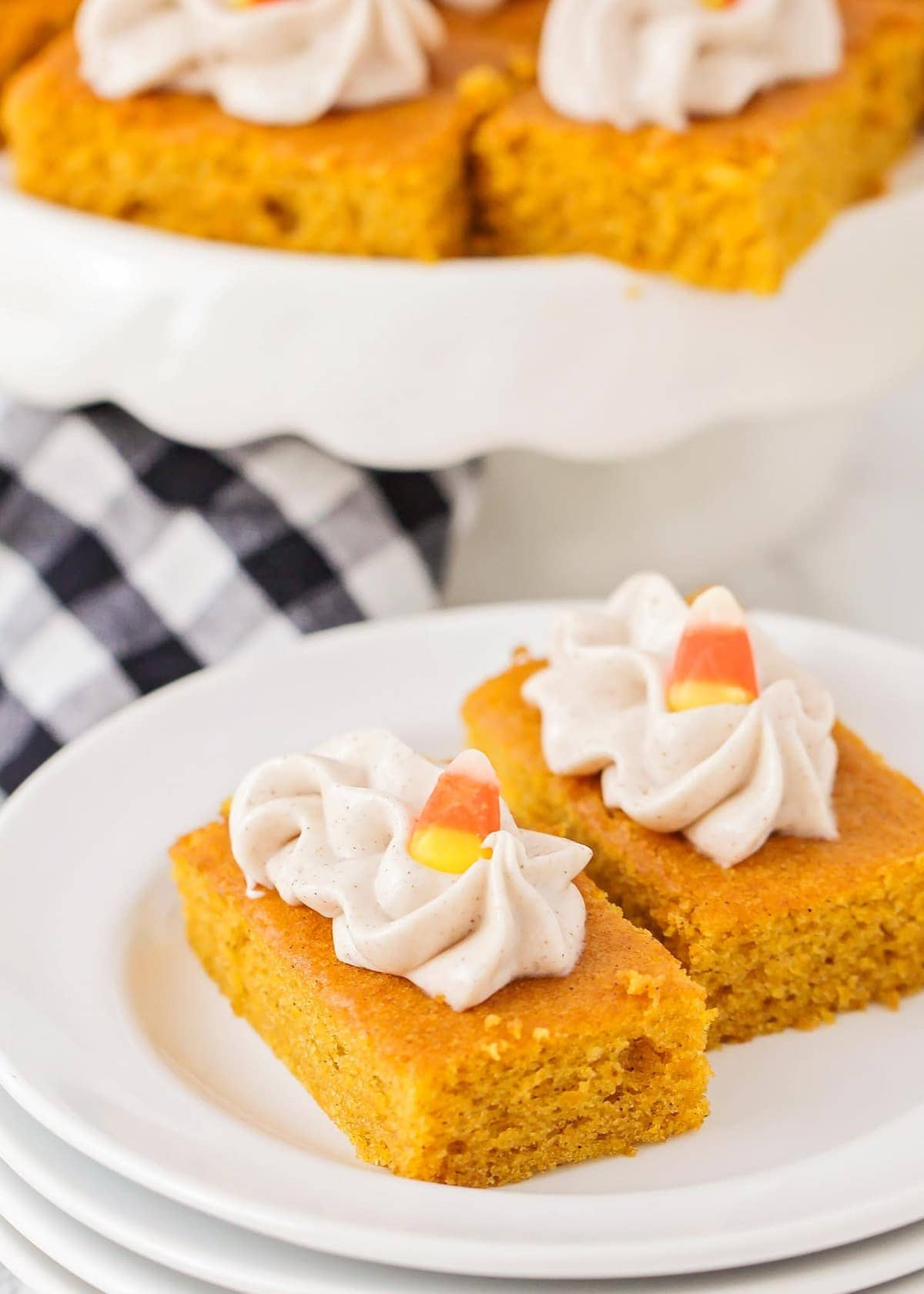close up of pumpkin bars with cream cheese frosting