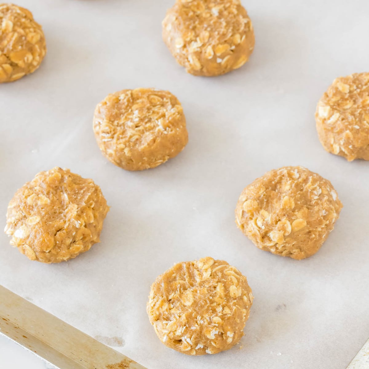 Pumpkin cookies with oats on baking sheet
