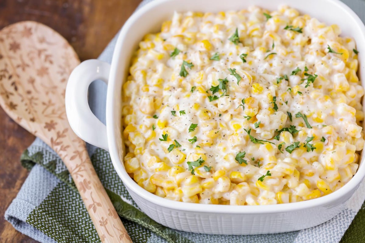 A casserole dish filled with creamed corn.