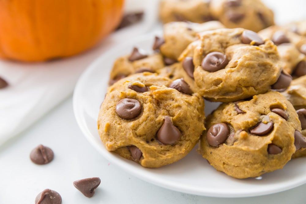 Pumpkin recipes - white plate of pumpkin chocolate chip cookies.