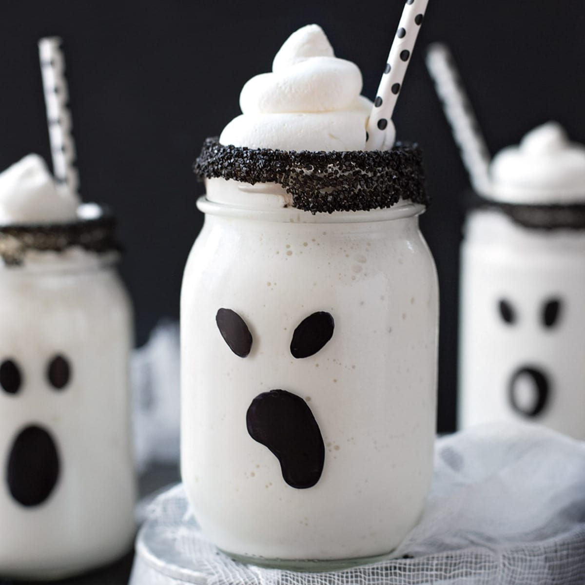 Halloween desserts - boo-nilla ghost milkshakes served in decorate glass jars.