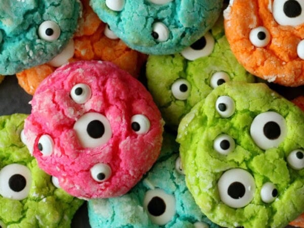 Gooey monster cookies piled together with big google eyes.