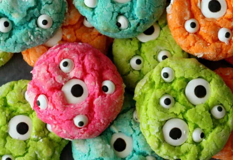 Gooey monster cookies piled together with big google eyes.