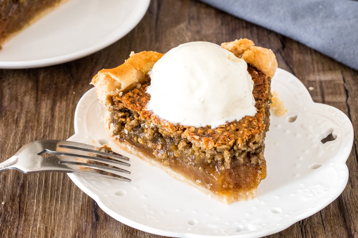 Fall dessert recipes - A slice of oatmeal pie with a bite taken out of it to show the gooey texture.