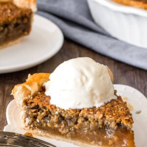 A slice of brown sugar oatmeal pie with a scoop of vanilla ice cream on top.