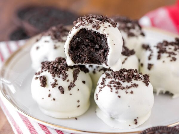 Oreo truffle balls stacked on a plate.
