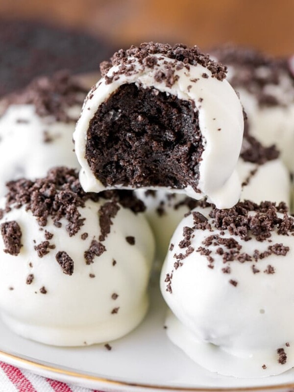 Oreo truffle balls stacked on a plate.