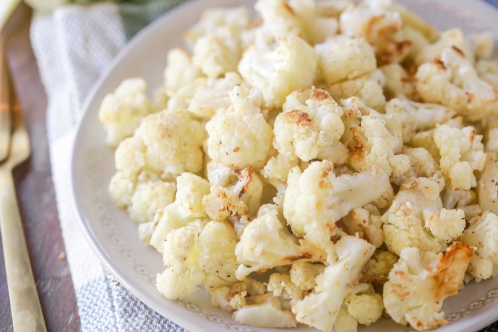 Easy side dishes - roasted cauliflower piled on a white plate.