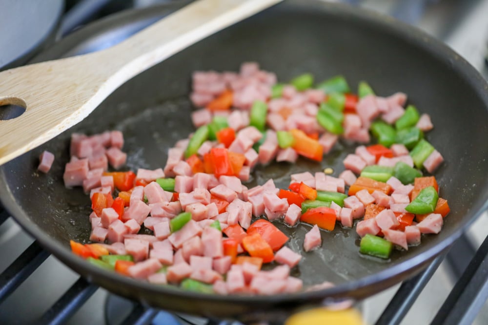 western omelette ingredients cooking in a pan