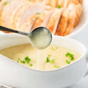 Spooning turkey gravy without drippings from a gravy boat.