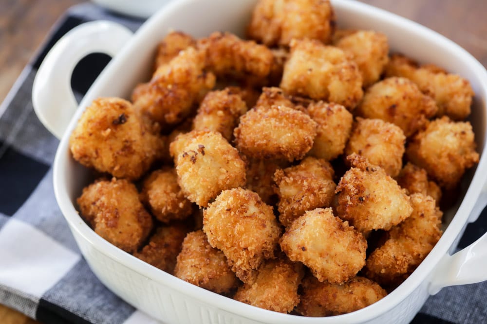 Popcorn chicken served in a white dish.