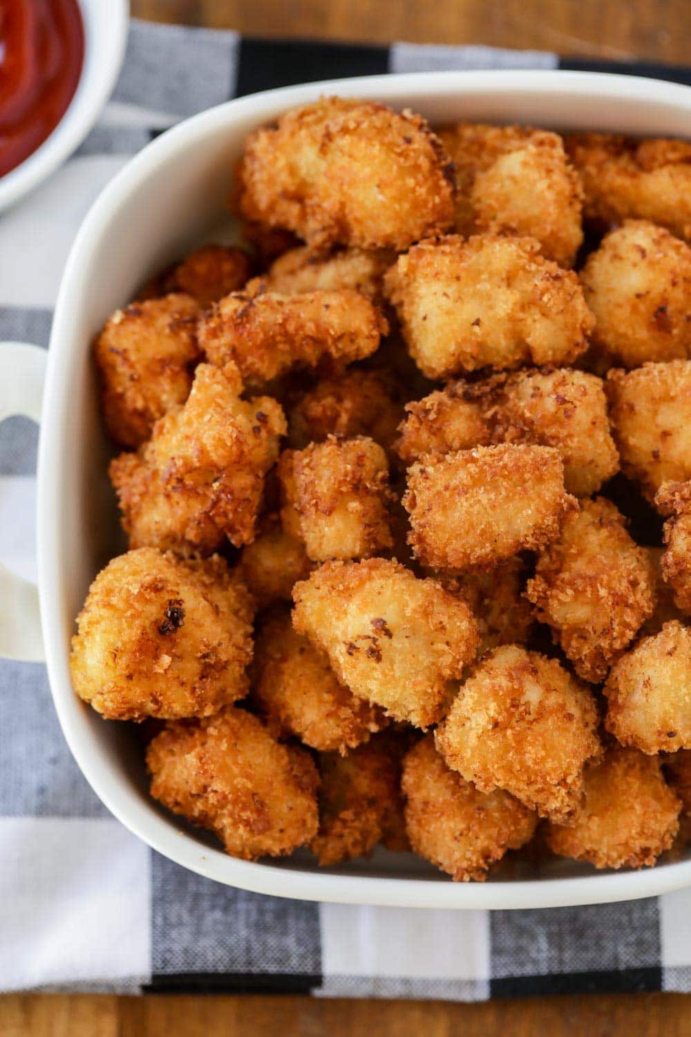 Popcorn chicken recipe served in a white dish.