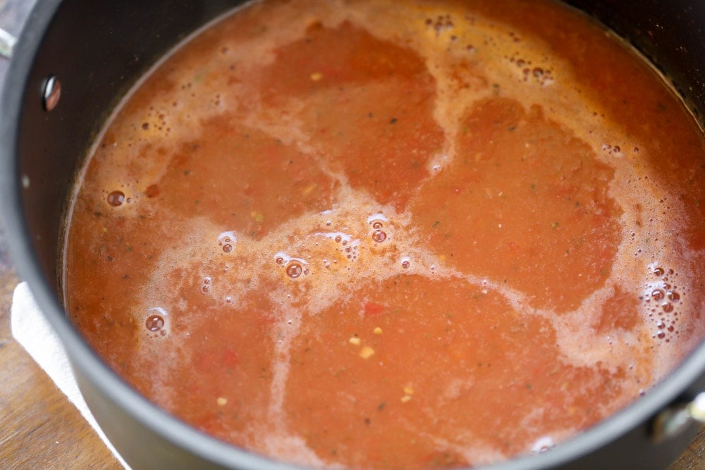 Tomato bisque cooking in a pot.