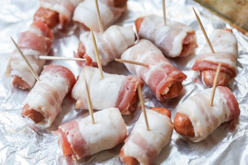 Just 3 ingredients to make candied Bacon Wrapped Smokies. They are the ultimate appetizer and always the first to disappear! Smokies wrapped in bacon and stuck with a toothpick.