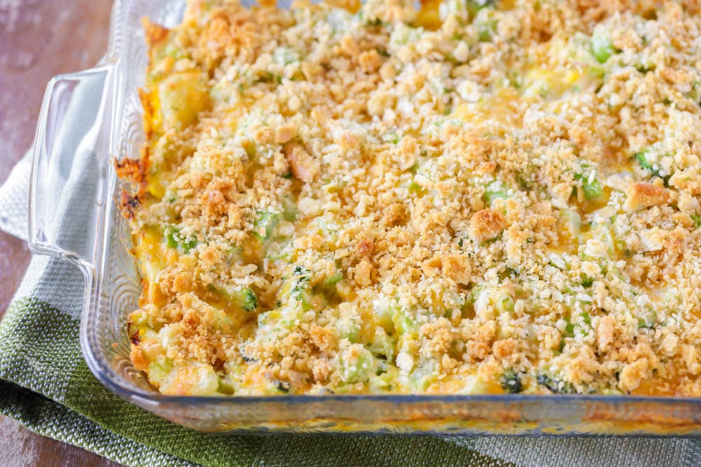Vegetable side dishes - a glass casserole dish filled with broccoli cheese casserole.