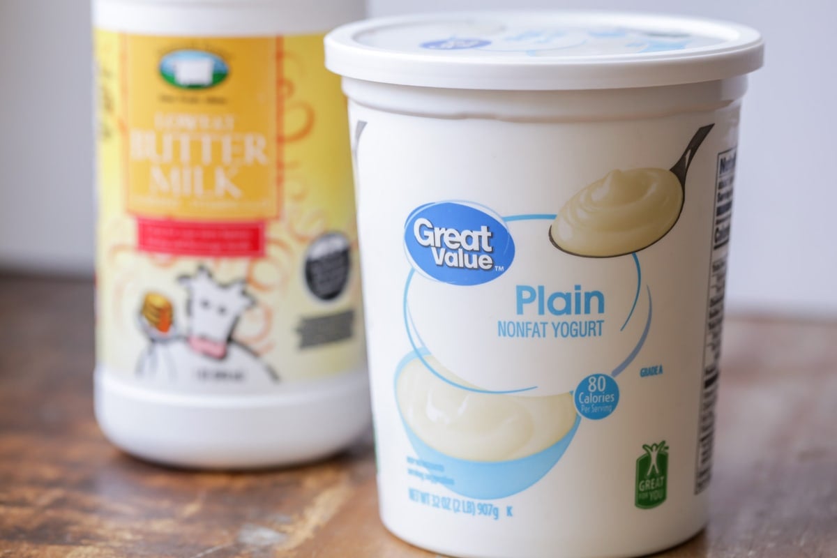 A container of yogurt and buttermilk on a counter.