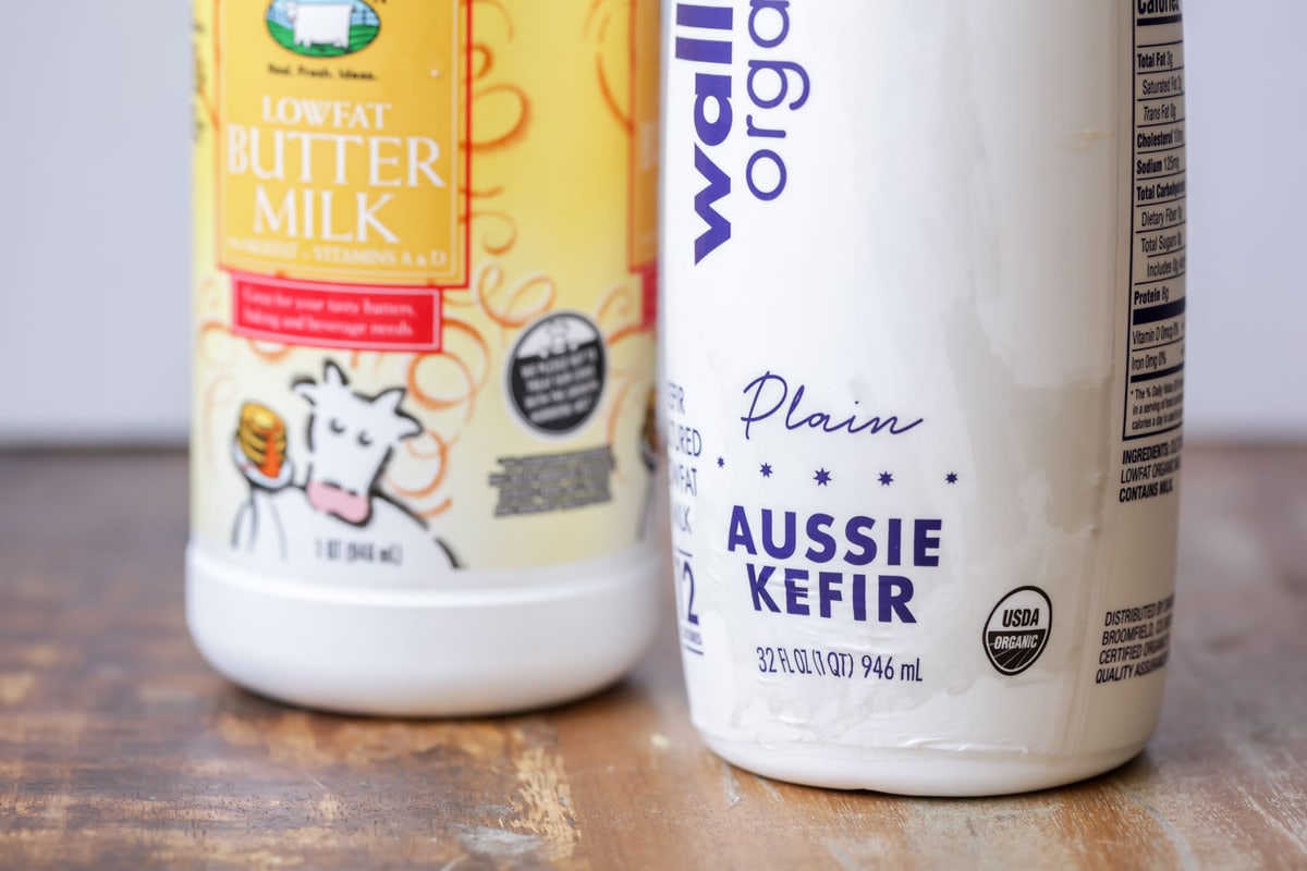 A carton of kefir and buttermilk on a counter for how to make buttermilk.