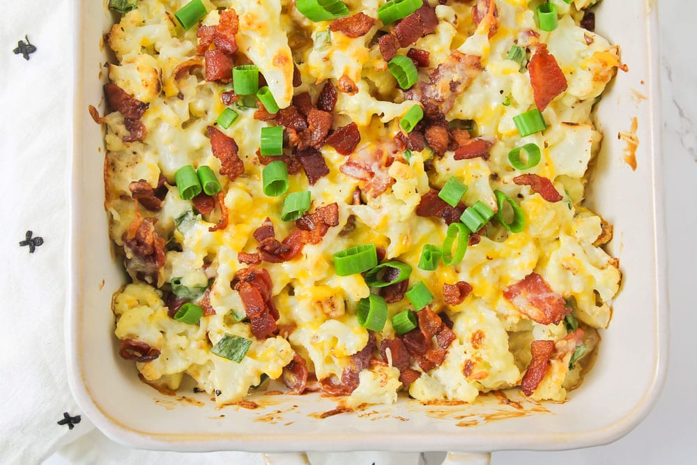 Cauliflower casserole with bacon, green onions, and cheese.