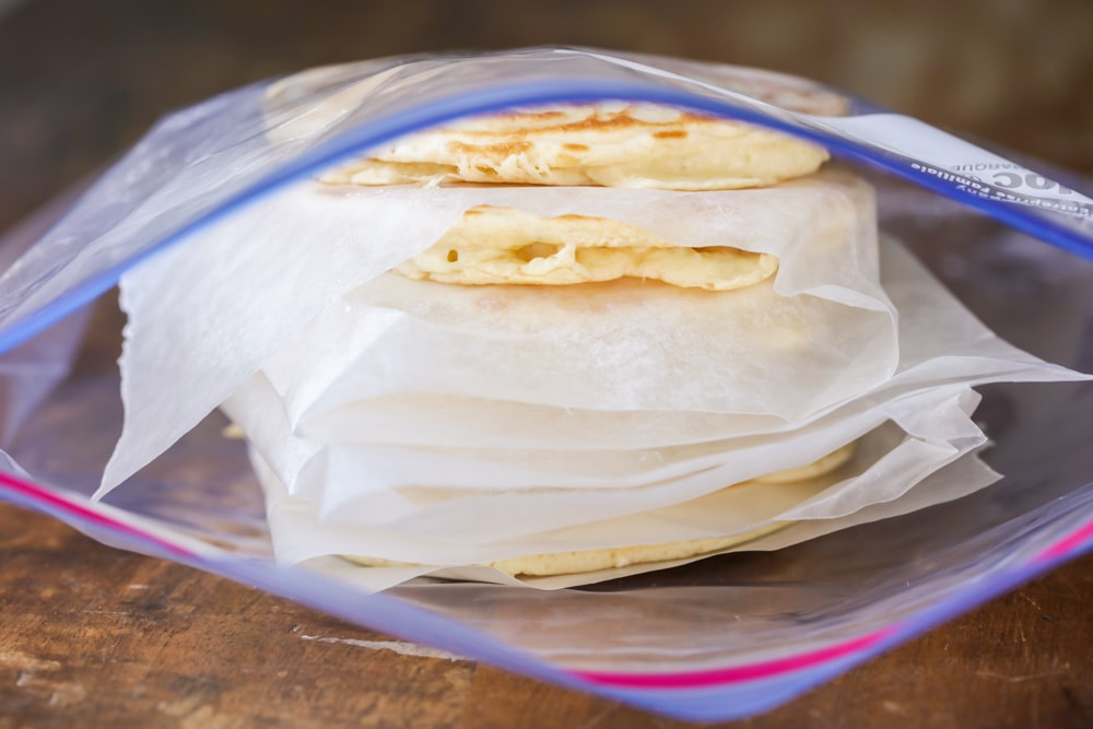 Pancakes and wax paper in a ziploc bag before freezing pancakes