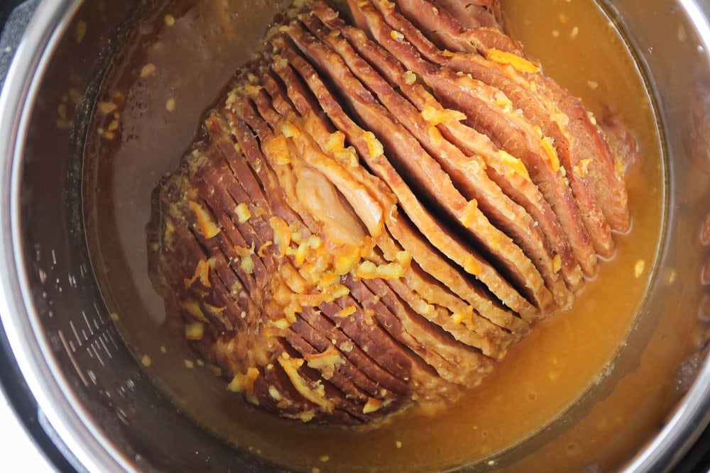 Close up of instant pot ham cooking in an instant pot.