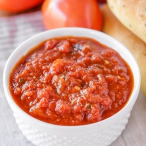 White ramekin with homemade marinara sauce.