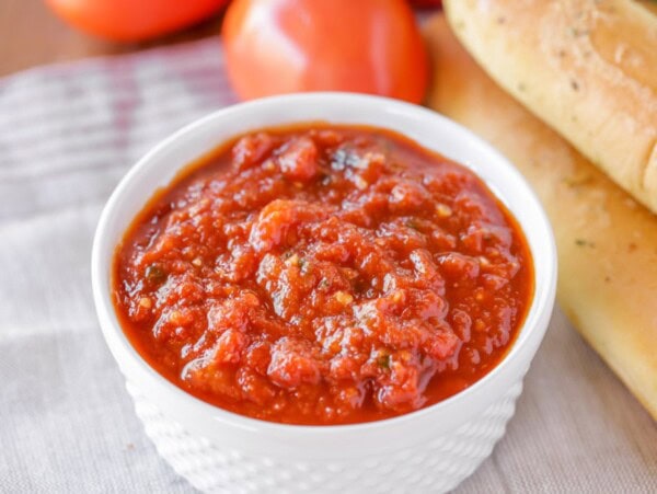 White ramekin with homemade marinara sauce.