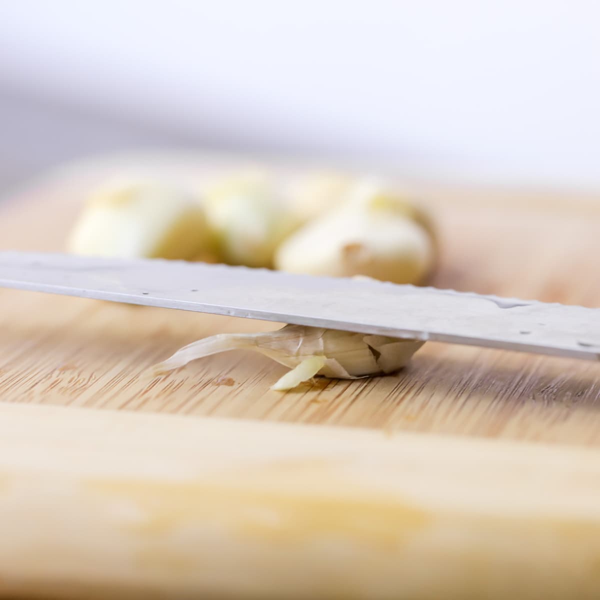 Mincing garlic with a knife