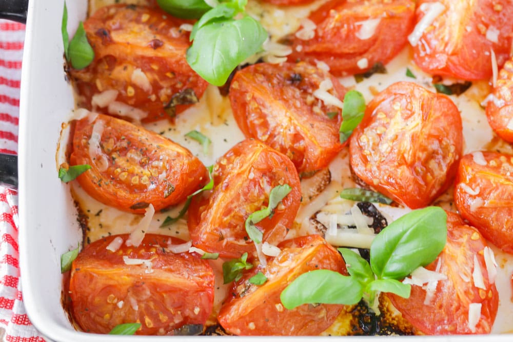 Roasted Tomatoes with fresh basil and parmesan cheese on top