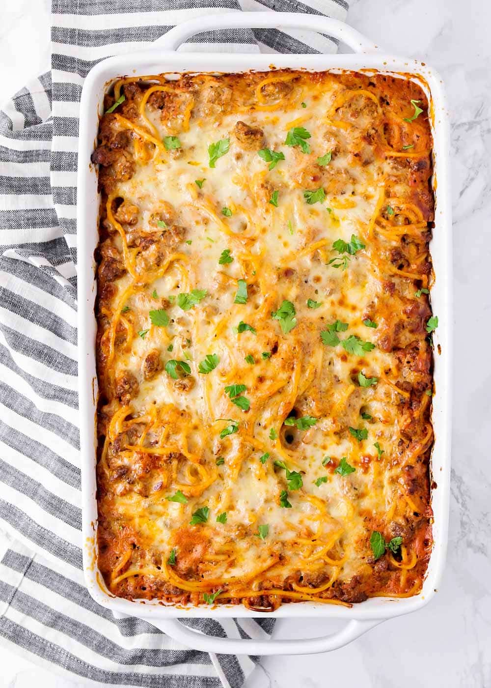 Baked spaghetti casserole close up image.