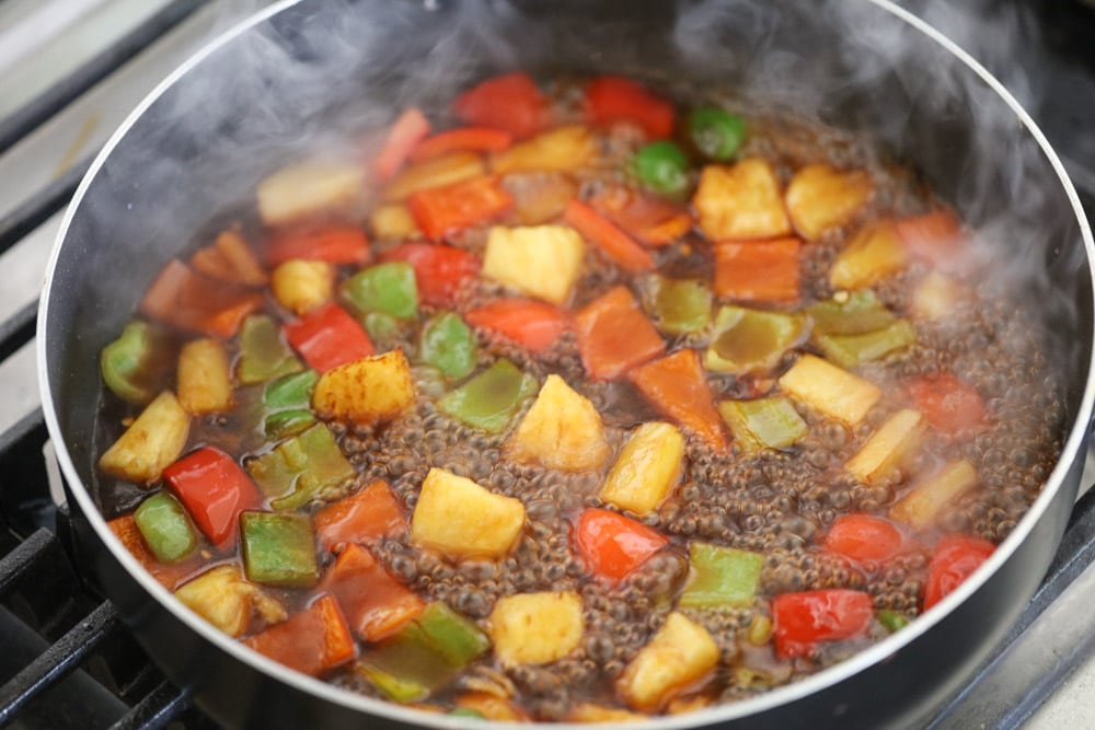 Pan full of Chinese sweet and sour sauce on veggies