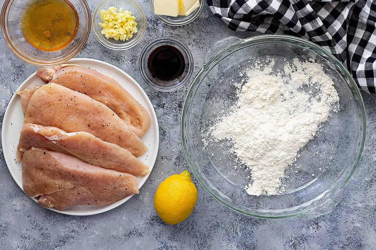 Ingredients for lemon chicken on a counter.