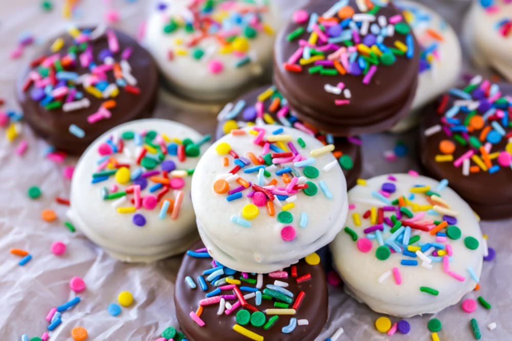 Chocolate covered Oreos with sprinkles on top