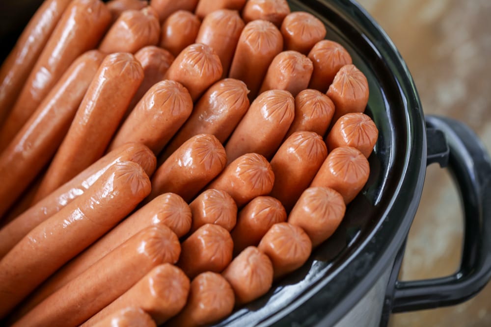 A bunch of hot dogs in a crock pot