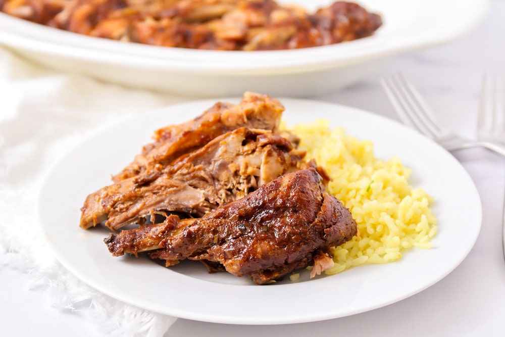 Crock pot ribs on a white plate.