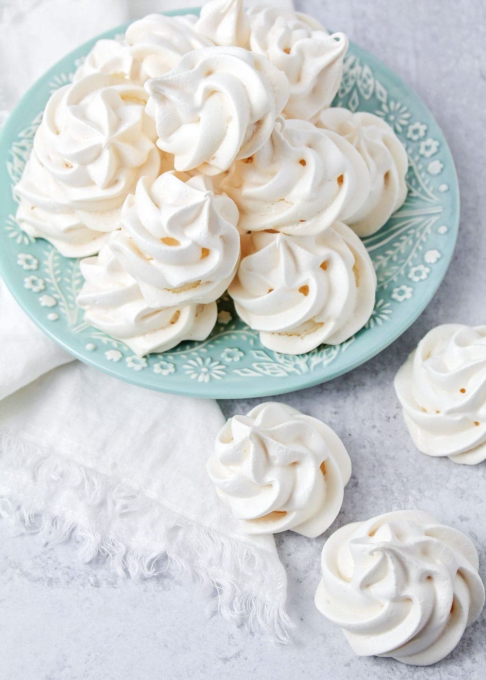 Close up of meringue cookies on a blue plate