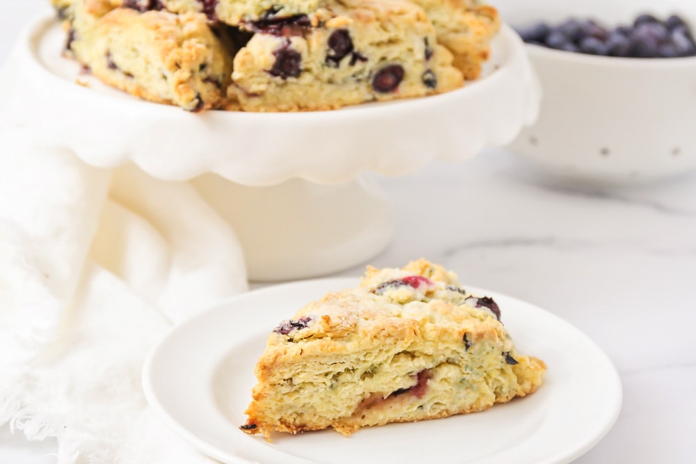 Blueberry scones recipe served on a white plate.