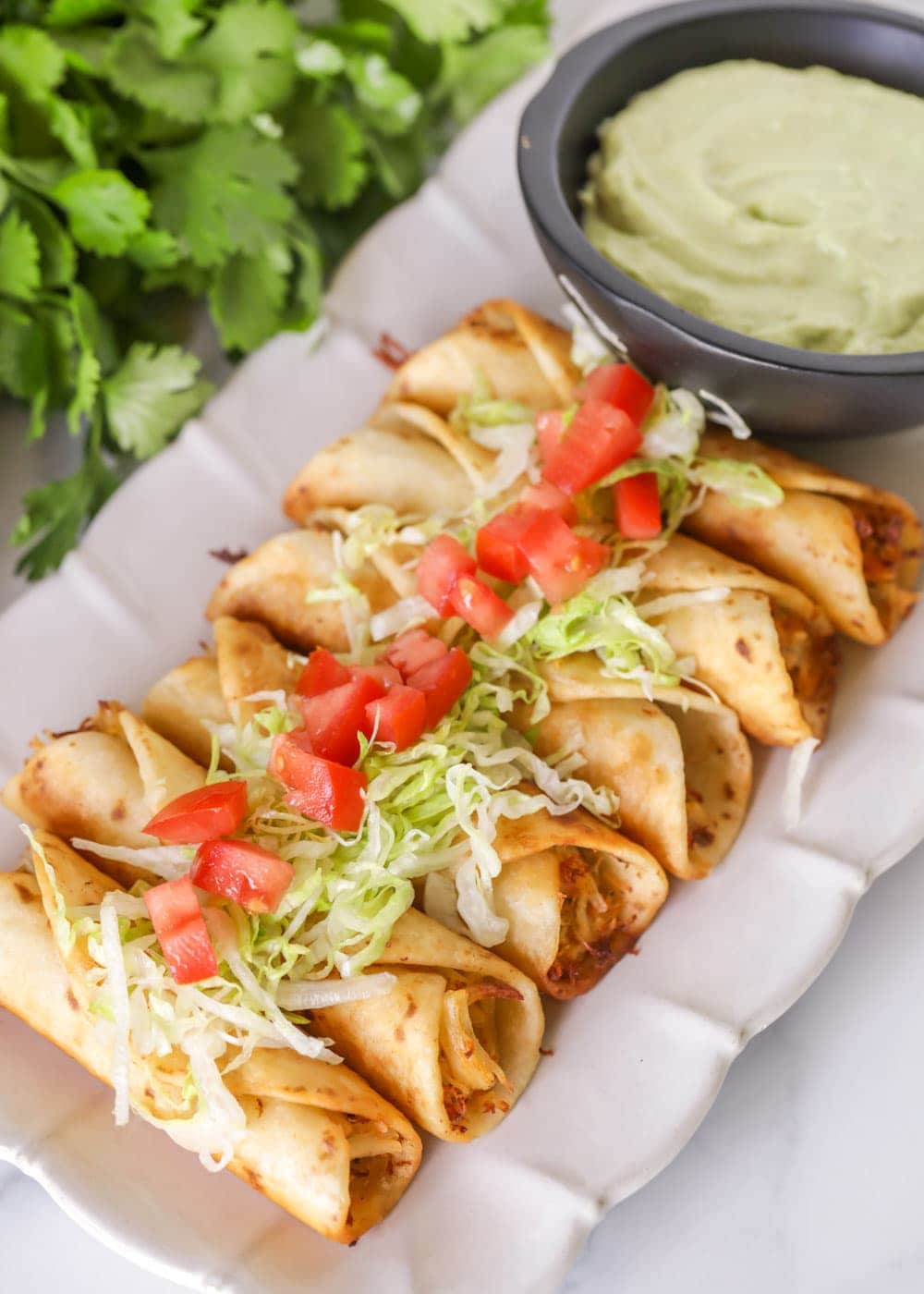 Chicken flautas on a serving platter