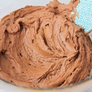 Chocolate buttercream frosting whipped in a bowl.