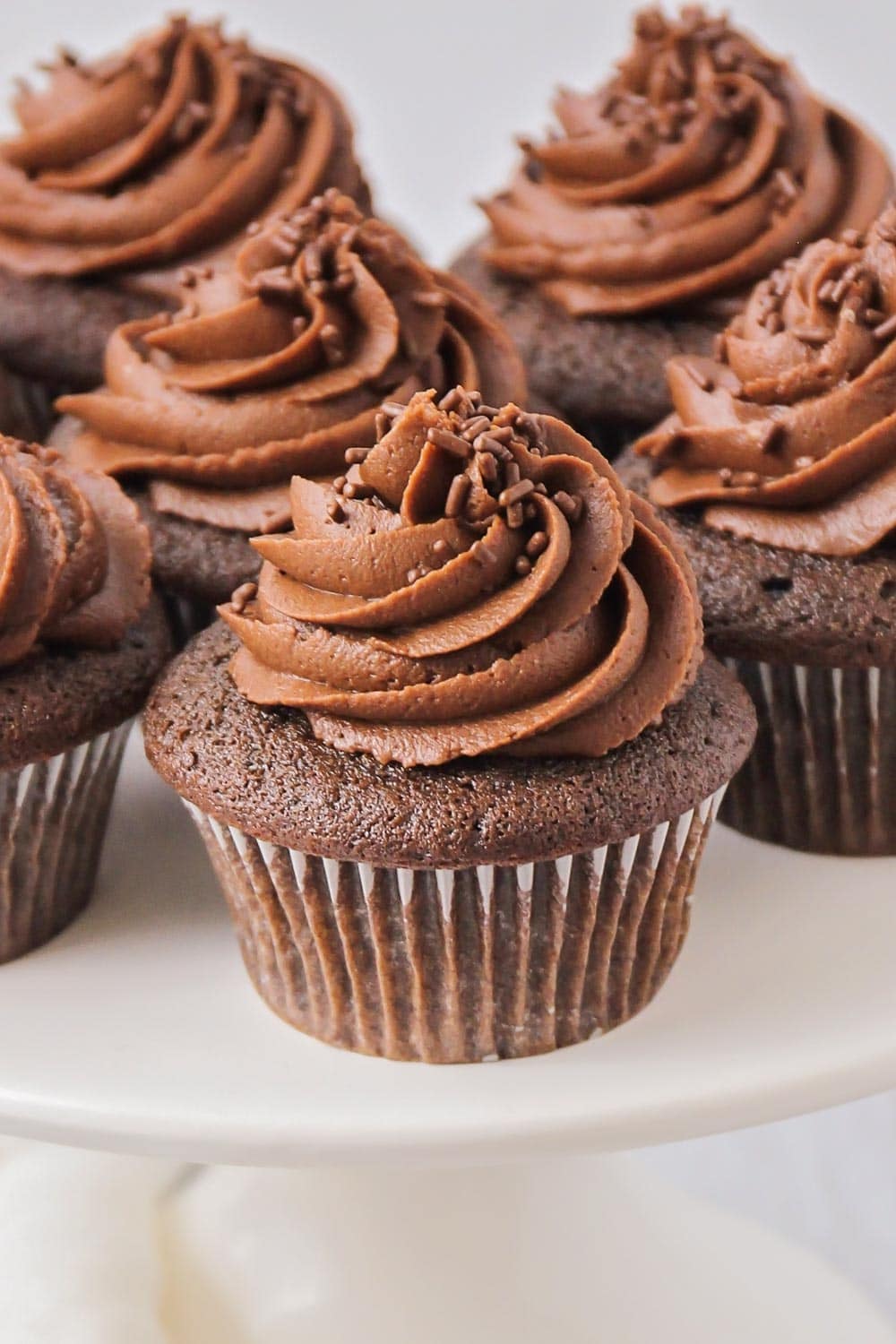 Chocolate buttercream on top of chocolate cupcakes 