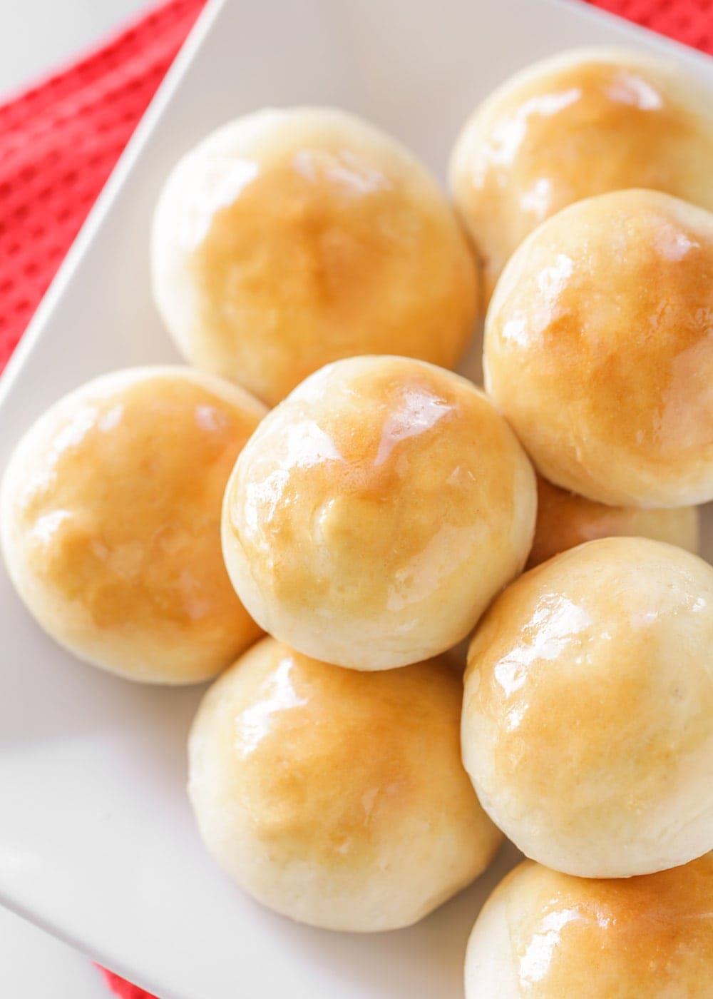 Close up of quick dinner rolls on a white plate