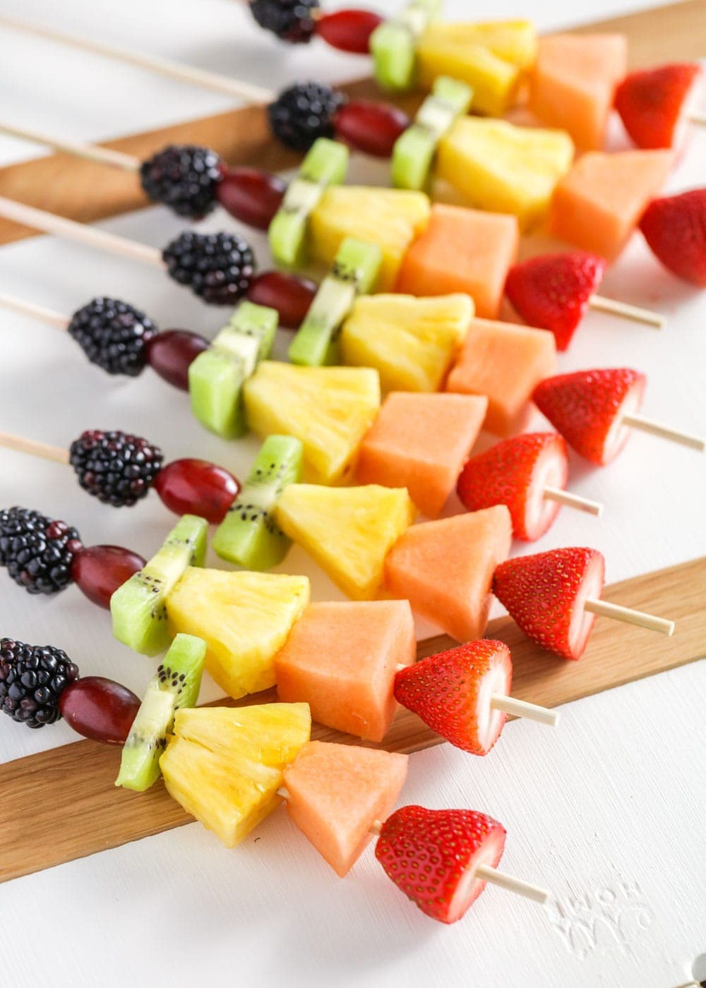 Close up of rainbow fruit kabobs