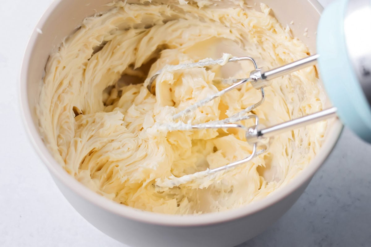 Mixing honey butter together in mixing bowl.