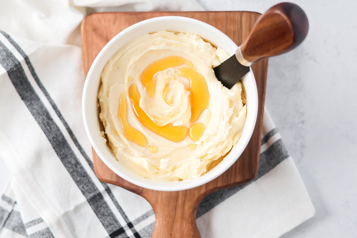 Honey butter with honey drizzled on top.
