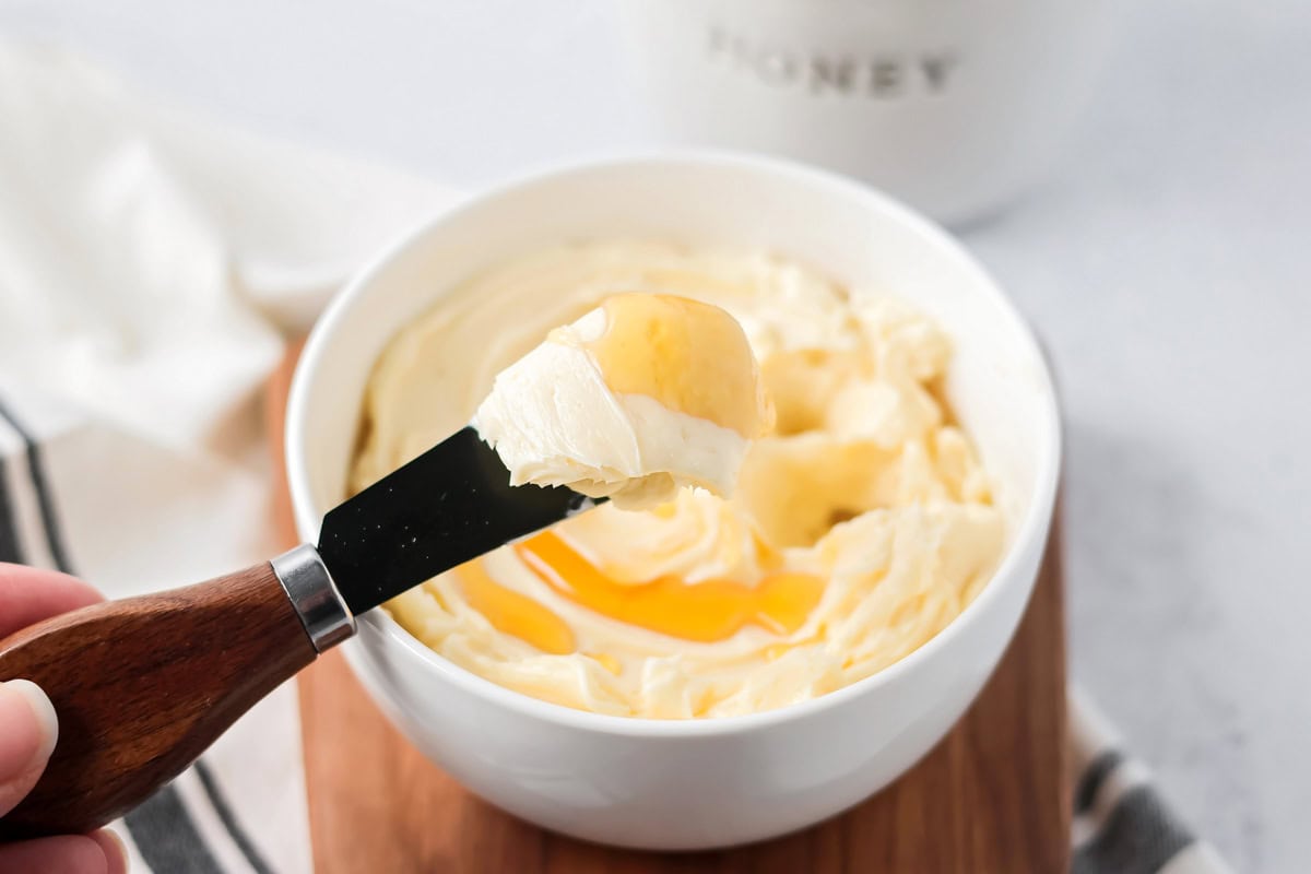 Honey butter being dished out.