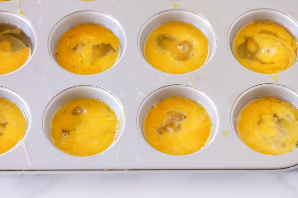 Broken eggs in muffin tin