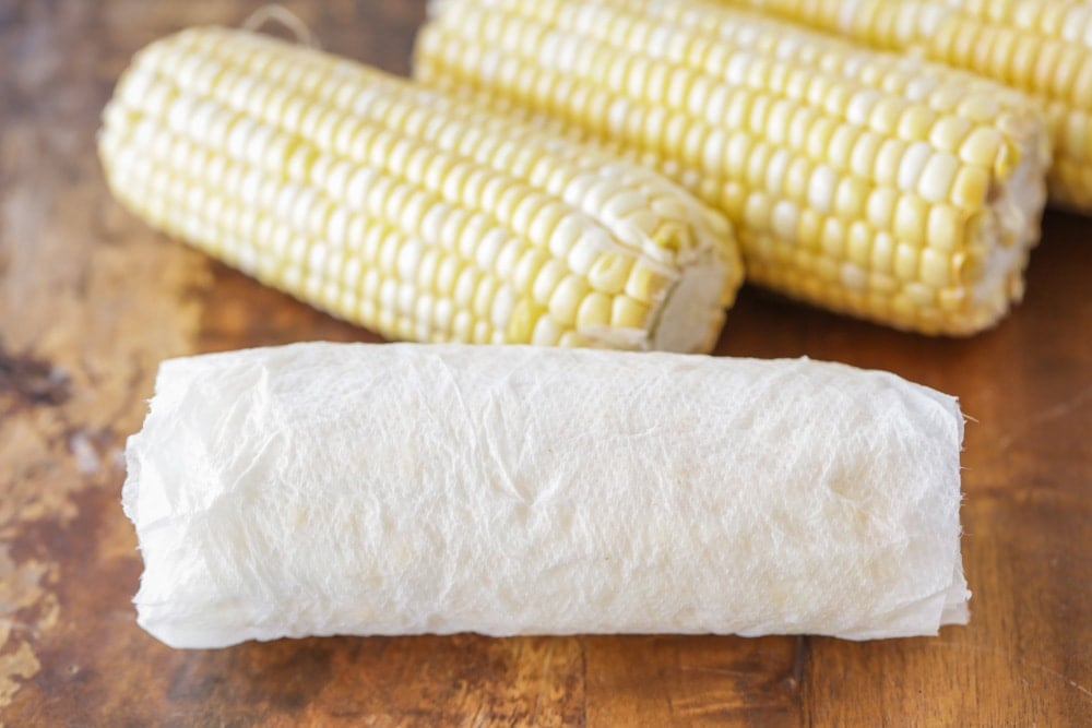 Wrapping corn on the cob in a wet paper towel before microwaving