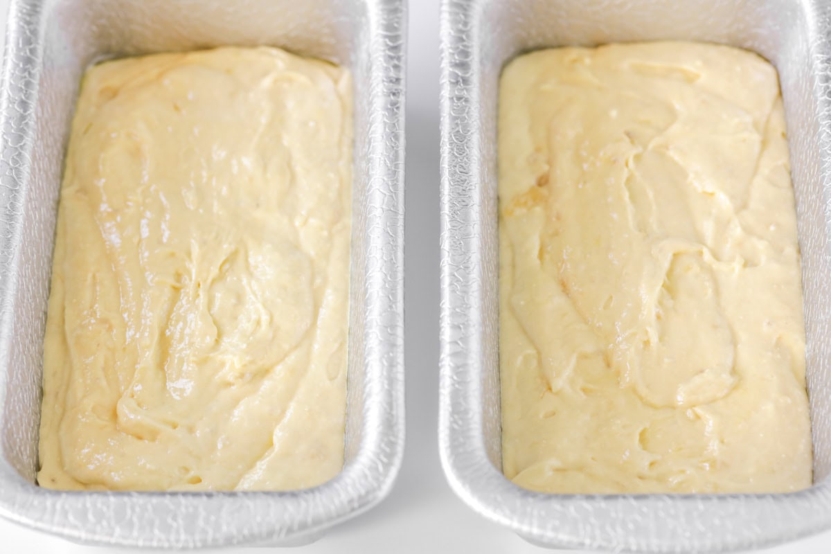 Three ingredient banana bread batter in bread pans